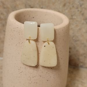 Artisan made opaque white and speckled off white hanging square earrings